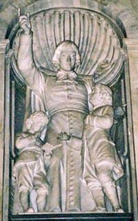 A statue of St. John Baptist teaching